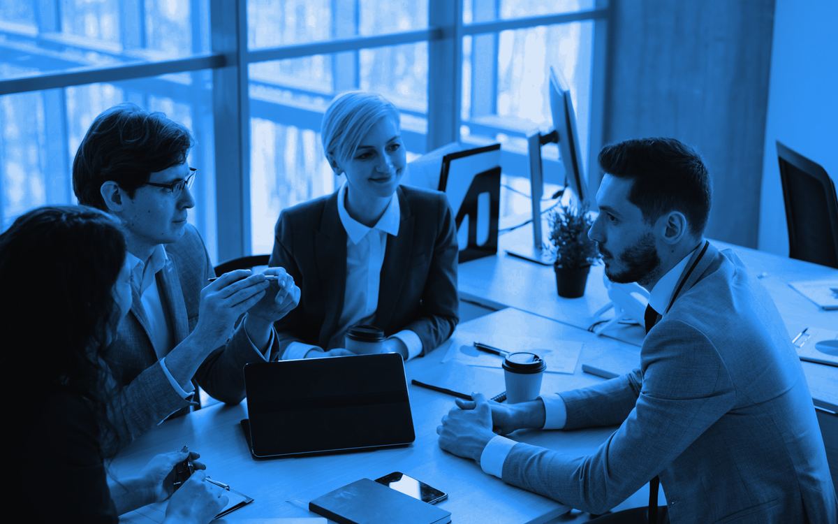A diverse team of young professionals collaborating in a modern office